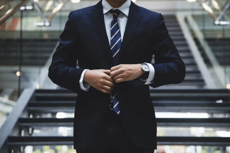 a man in a suit walking in an office
